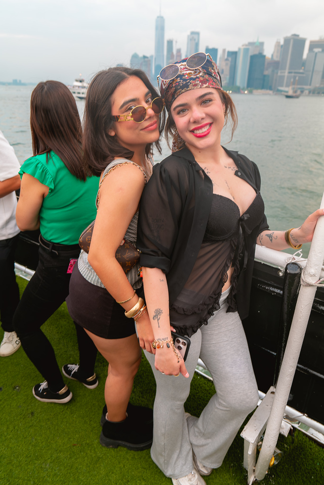 Guests posing with the Lower Manhattan skyline behind them